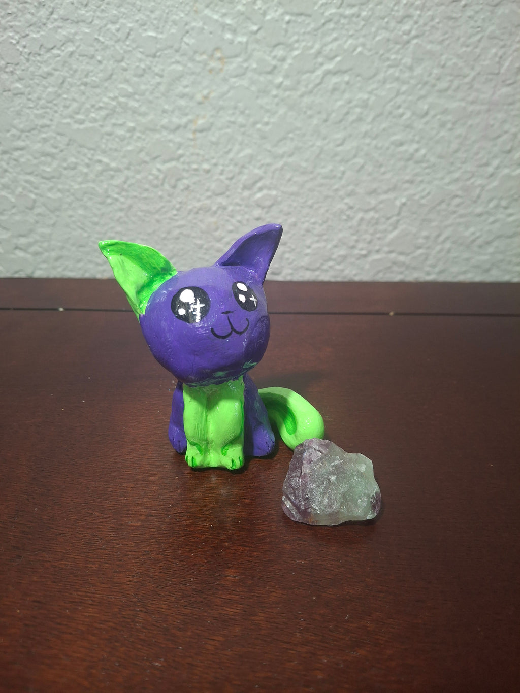 green and purple cat
