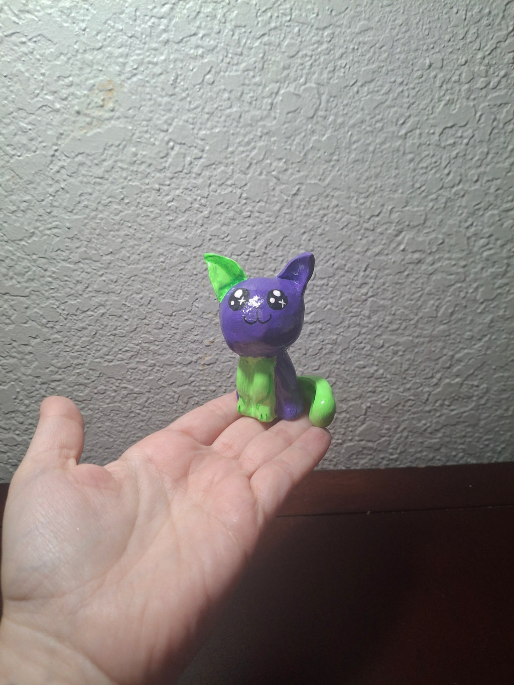 green and purple cat
