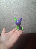 green and purple cat